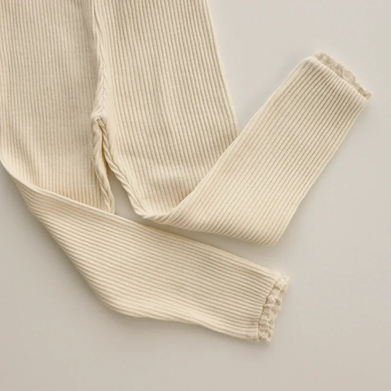 Pack of three baby girls' ribbed cotton leggings in assorted colors for everyday toddlerfashion.