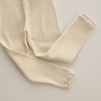 Pack of three baby girls' ribbed cotton leggings in assorted colors for everyday toddlerfashion.