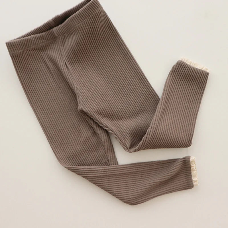 Infantwear ribbed cotton leggings for baby girls, providing warmth and softness.
