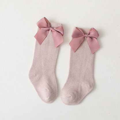 Essential baby girl knee-high socks with anti-slip soles and decorative bows for everyday wear