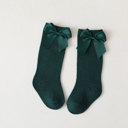 Pack of assorted baby knee-high socks with bows: pink, white, blue, perfect for girls