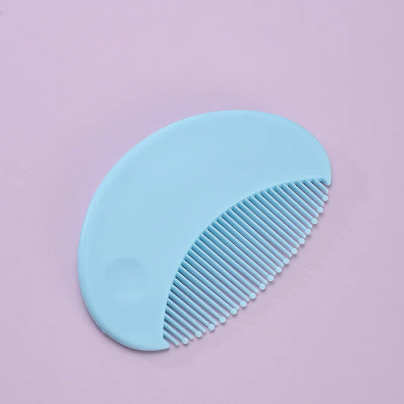 Close-up of baby nail clippers and file from a baby grooming and health set.
