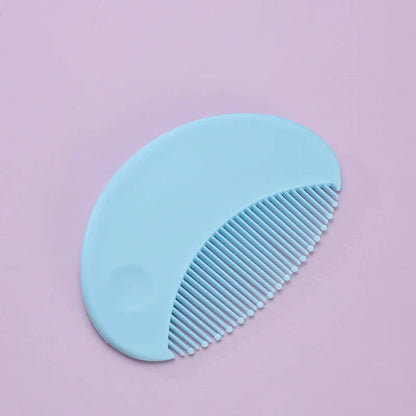 Close-up of baby nail clippers and file from a baby grooming and health set.