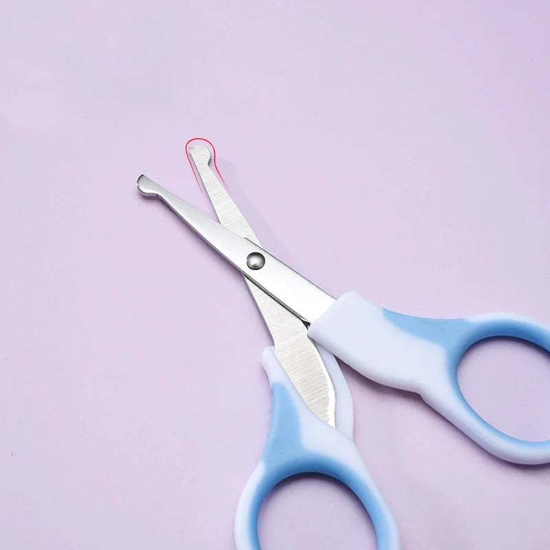 Nasal aspirator for infants, a key component of a baby grooming and hygiene kit.