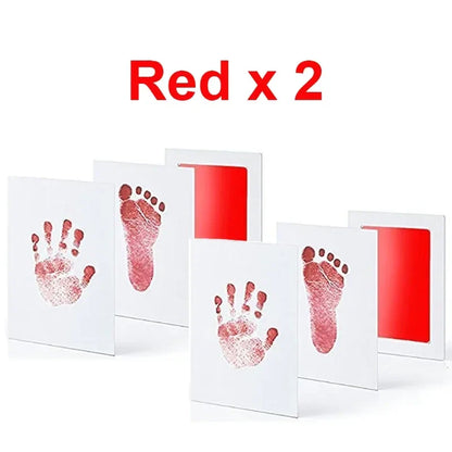Hand holding the inkless ink pad ready for a baby's print, easy to use kit