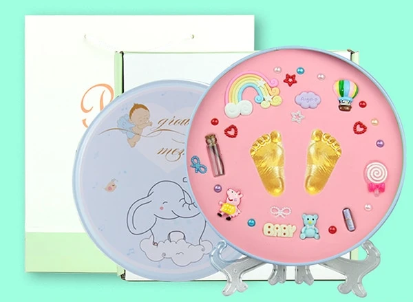 Soft non-toxic clay kit for baby handprint and footprint art in a beautiful memory frame.