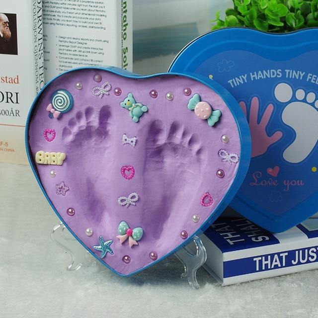 Non-toxic clay baby handprint footprint kit, safe infant keepsake and nursery decor gift.