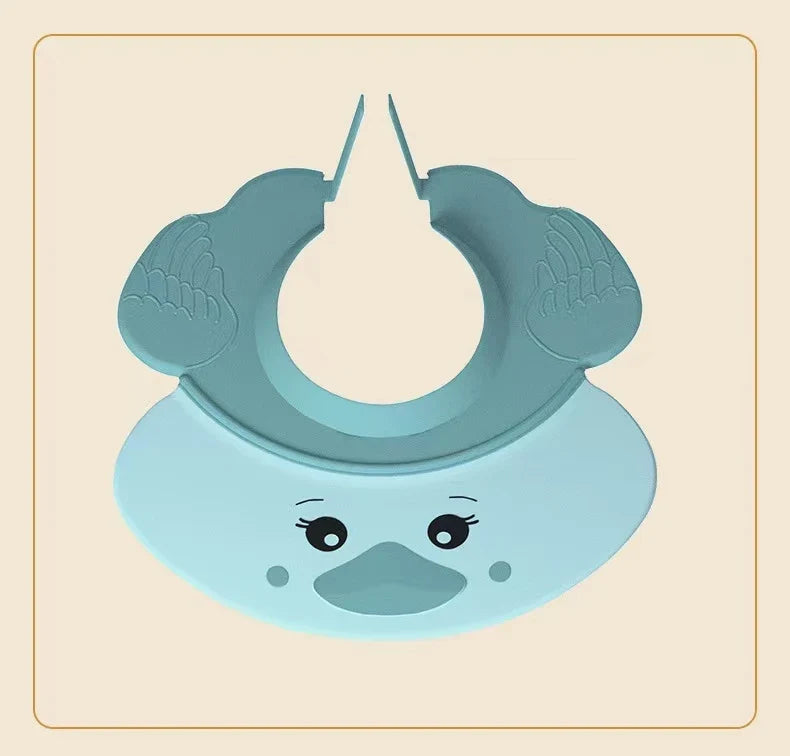 Multiple colored Baby Hippo Shampoo Visor Caps (blue, pink, yellow) neatly stacked, bath accessories.