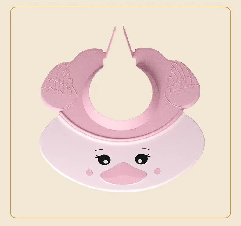 Baby's head with a blue Baby Hippo Shampoo Visor Cap, preventing water from reaching the face, baby care.
