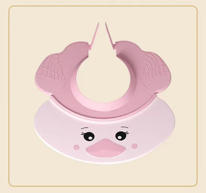 Baby's head with a blue Baby Hippo Shampoo Visor Cap, preventing water from reaching the face, baby care.