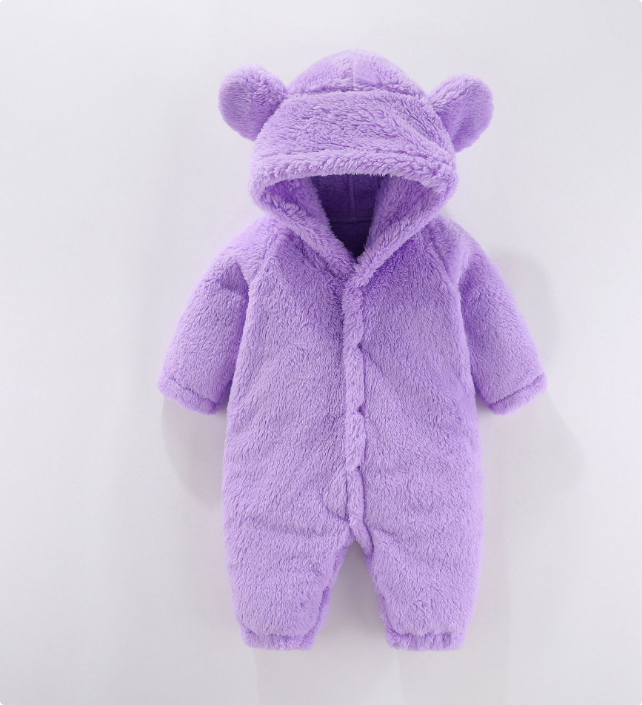 Close-up of soft fleece fabric on a baby hooded romper, comfortable infant wear.