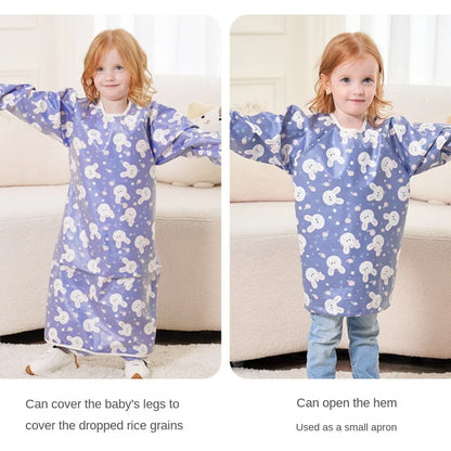 A baby happily painting while wearing a long-sleeved waterproof smock, keeping clothes clean.