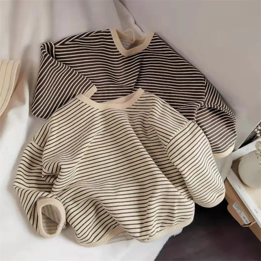Baby in blue & white striped long sleeve cotton t-shirt, casual comfort for toddlers. 85 characters