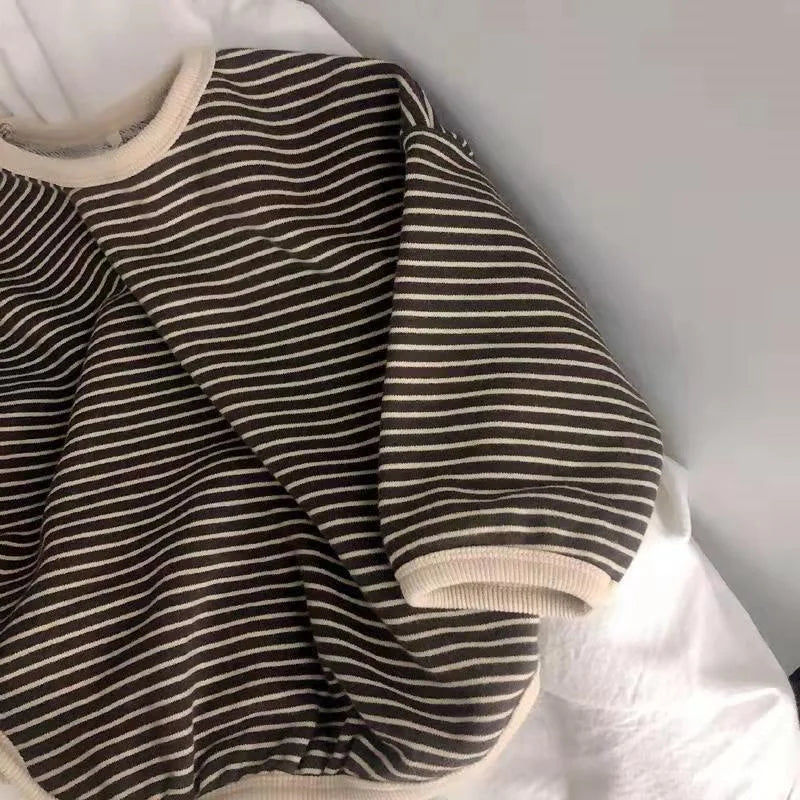 Unisex kids' black & white striped long sleeve t-shirt, versatile baby fashion item. 90 characters
