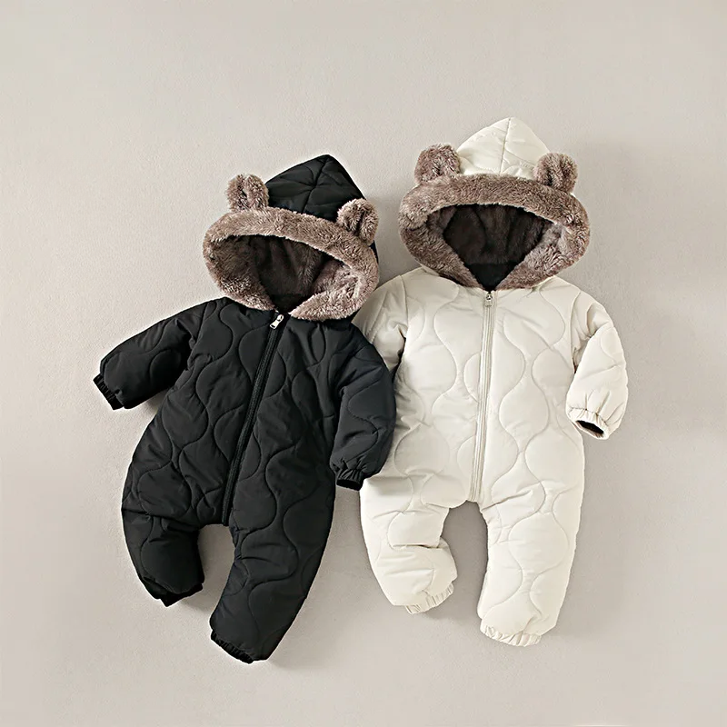Baby in cozy fleece hooded jumpsuit, full body warmth unisex romper for infant winter.