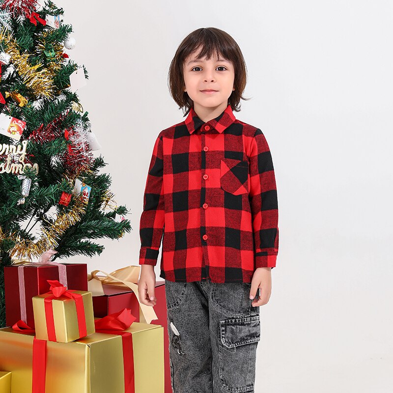 Cute baby in a cozy red plaid outfit, suitable for family coordinated apparel and gifts.
