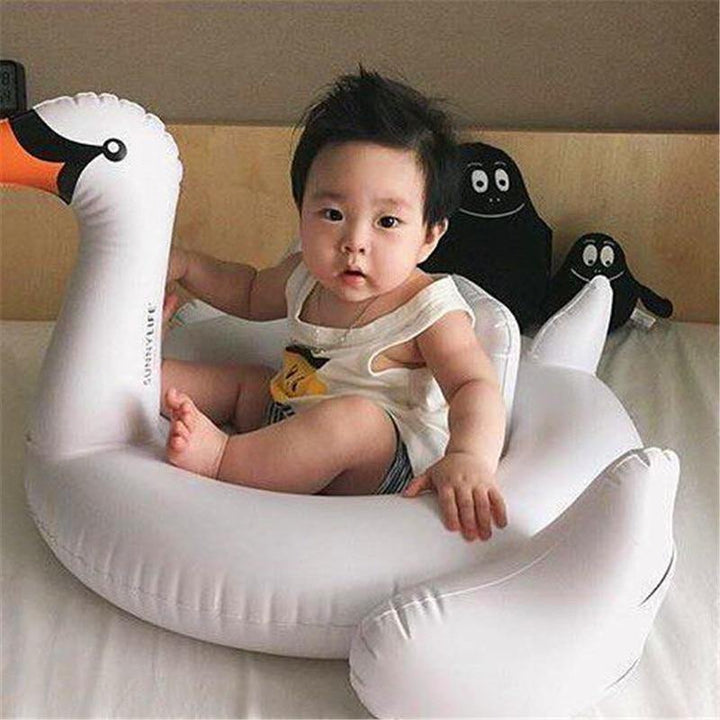 Close-up of a baby swimming ring, a white swan design inflatable pool toy