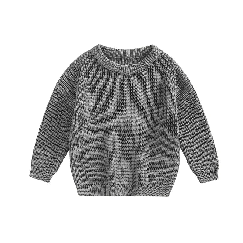 Stack of colorful knitted baby sweaters, a variety of options for cozy baby tops.