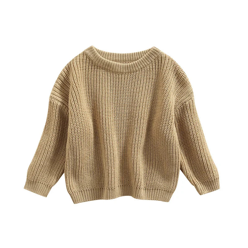 Back view of a baby wearing a grey knitted sweater, simple and cozy baby clothing.