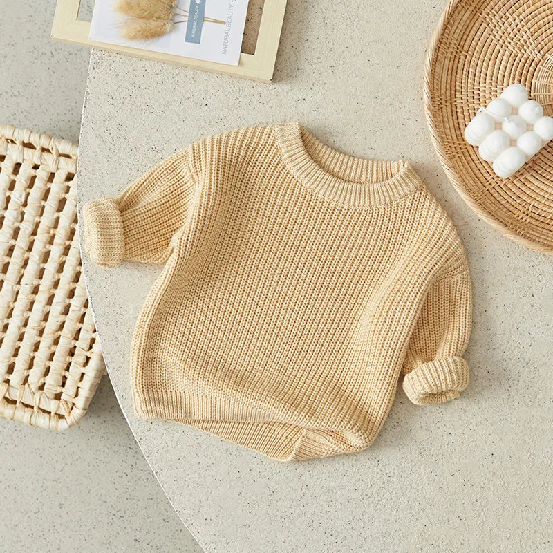 Unisex infant knitted pullover sweater in cream, perfect casual baby clothes for comfort.