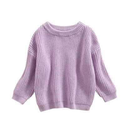 Collection of unisex baby knitted sweaters in different sizes for infants and toddlers.