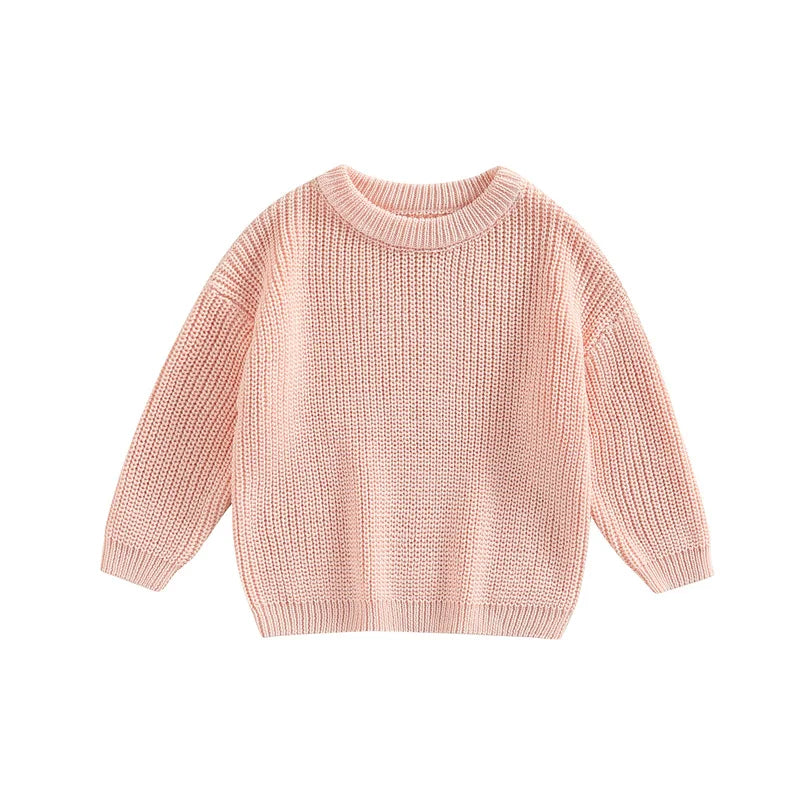 Knitted baby top in a neutral cream color, easily paired with other casual baby clothes.