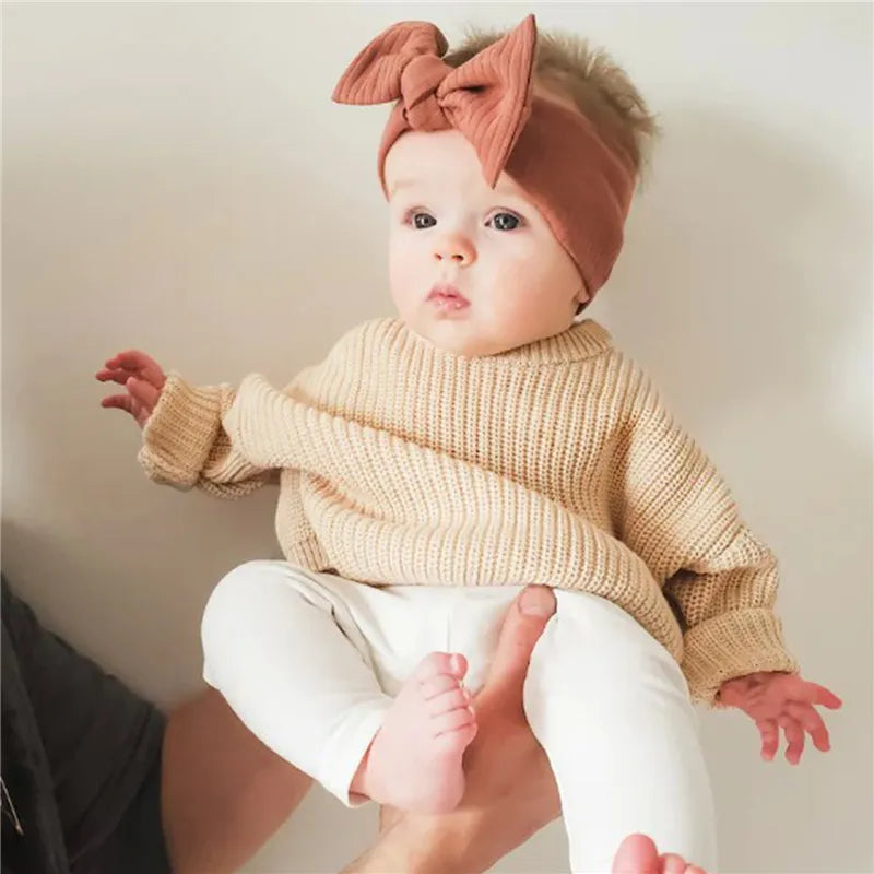Assortment of knitted long sleeve toddler sweaters, essential cozy baby tops.