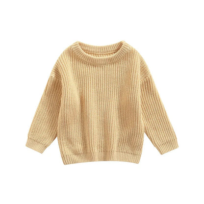 Folded cotton blend baby sweater, showcasing its soft and cozy material for infants.