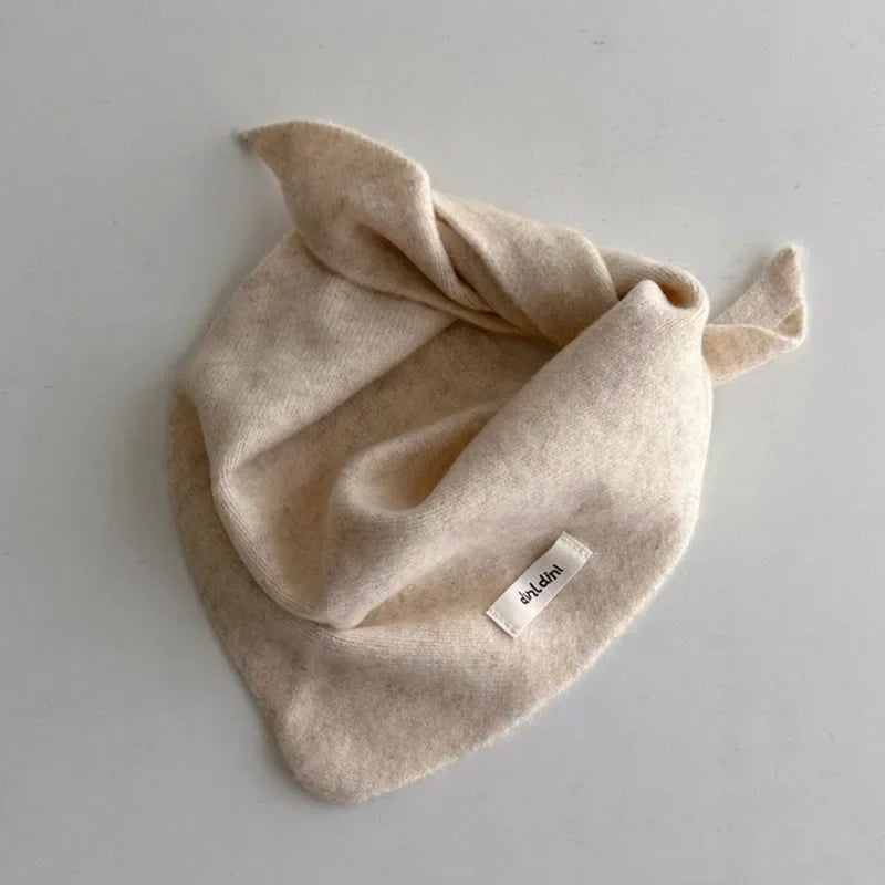 Soft knitted cashmere-feel triangle scarf for children, ideal for cold weather comfort.