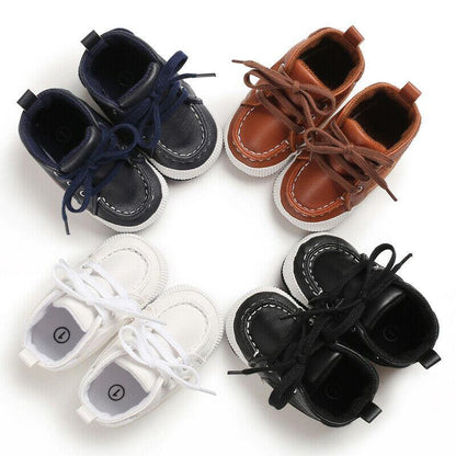 Infant ankle boots with soft leather, lace-up closure for secure fit, non-slip sole for new walkers.