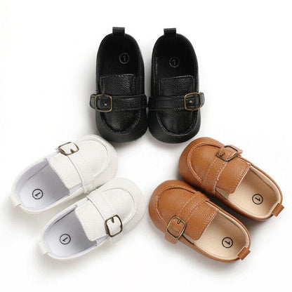 Close-up of baby leather walker boots, showcasing soft sole and stylish lace-up design for infants.