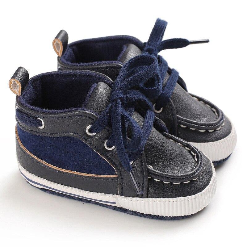 Baby walker shoes in genuine leather, featuring lace-up fronts and flexible soft sole for comfort.
