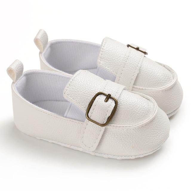 Stylish non-slip baby ankle boots, made from soft leather with secure lace-up closure for active toddlers.