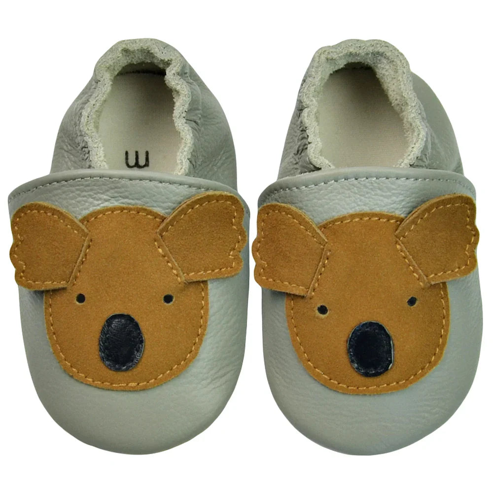A pair of comfortable baby shoes: black genuine leather soft sole moccasins