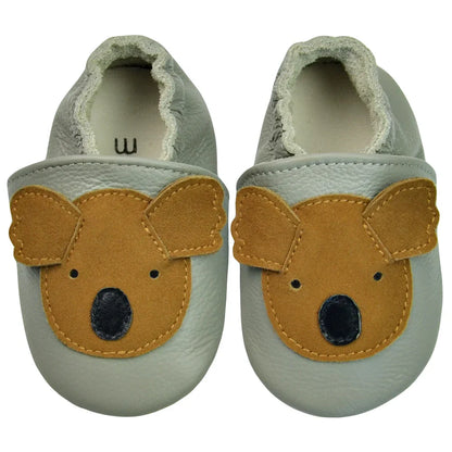 A pair of comfortable baby shoes: black genuine leather soft sole moccasins