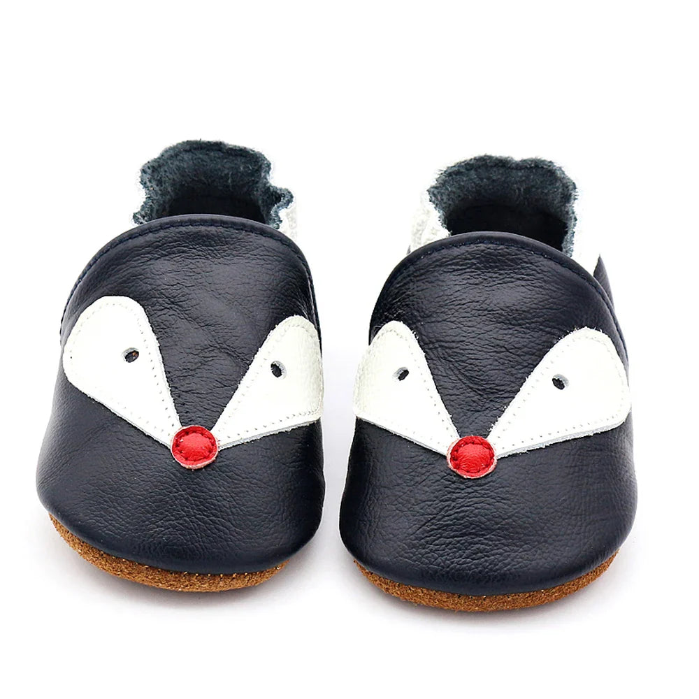 First walking shoes: white leather soft sole moccasins promoting natural foot movement
