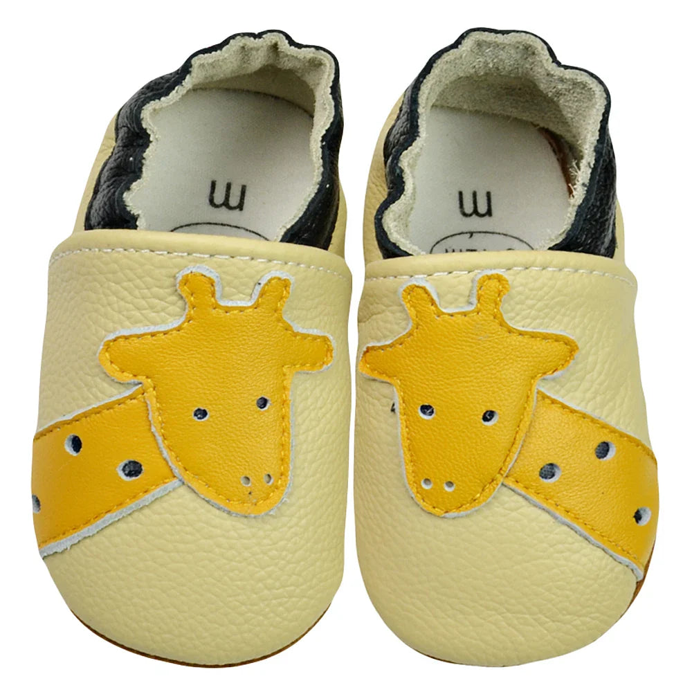 Baby accessories: yellow leather soft sole moccasins, an essential item for newborns