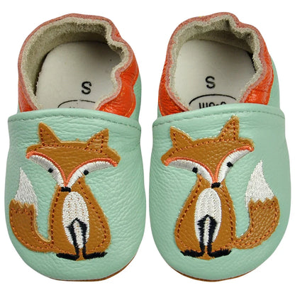 Two pairs of baby leather moccasins, tan and pink, displayed side-by-side