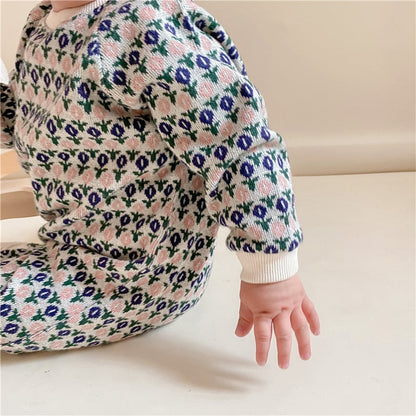 Close-up of diamond knit detail on a baby long sleeve romper, perfect for infant fashion