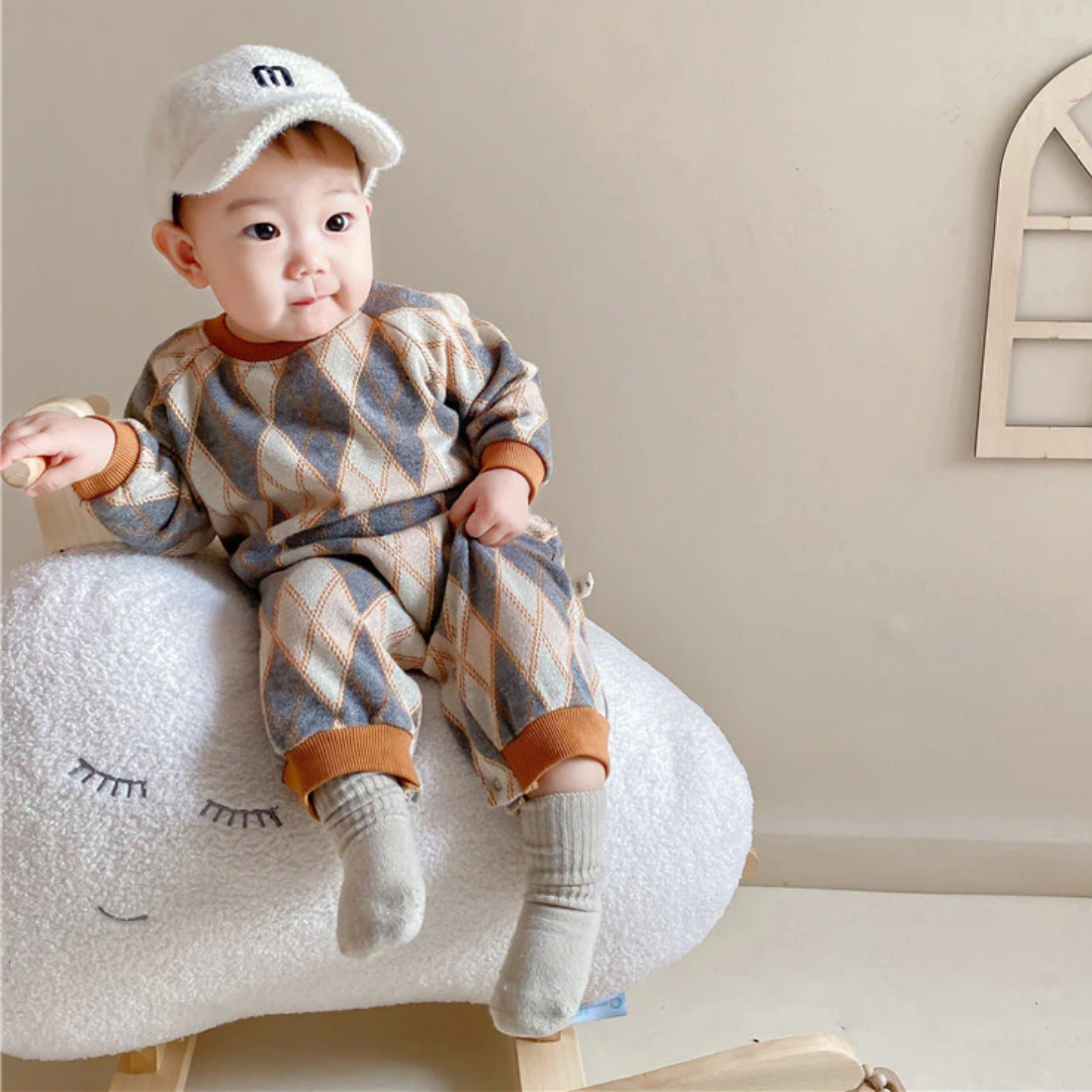 Toddler in a comfortable cotton baby romper with a stylish diamond knitted texture