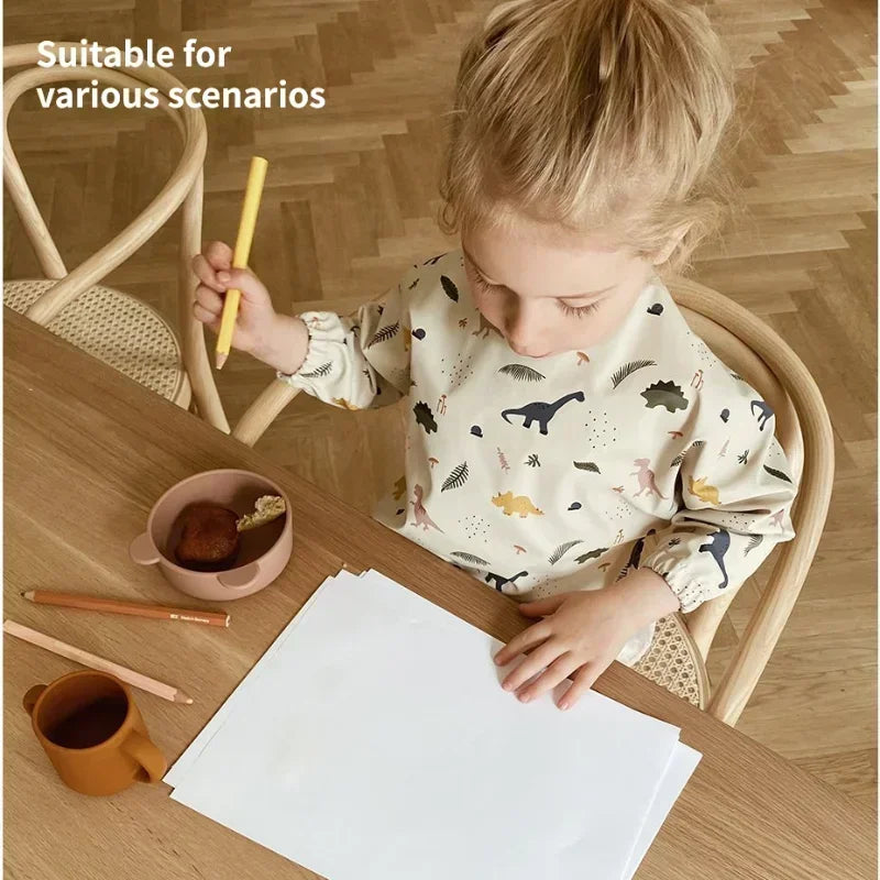 Yellow long sleeve waterproof bib with animal print, ideal for baby feeding and art activities