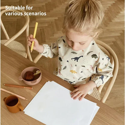 Yellow long sleeve waterproof bib with animal print, ideal for baby feeding and art activities
