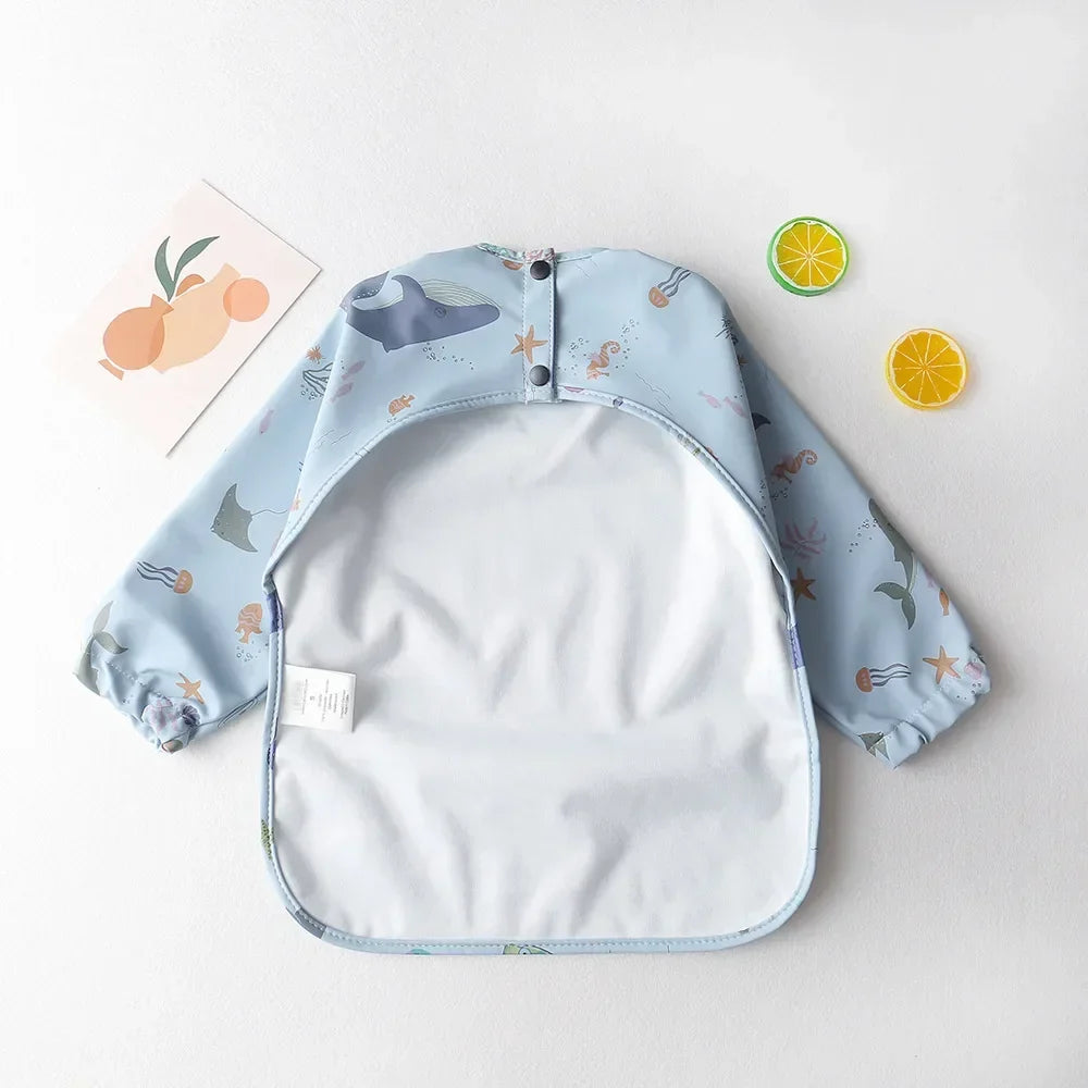 Set of three long sleeve waterproof baby bibs in various patterns for versatile use