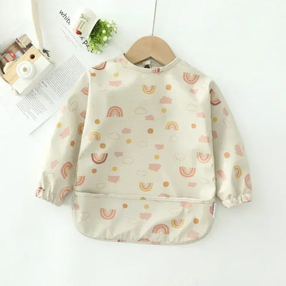 Long sleeve waterproof toddler bib with elastic cuffs, ensuring no food leaks onto clothes