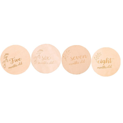 Close-up of elegant wooden baby milestone cards, 12 month set for baby pictures, newborn keepsake