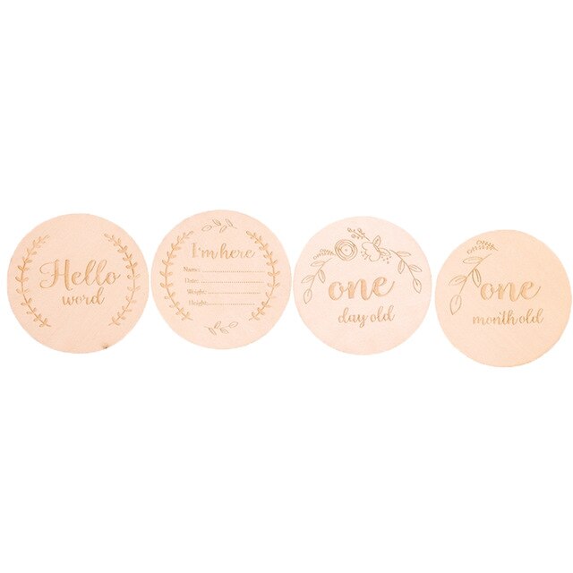 Various wooden baby milestone cards arranged, ideal baby photo props and baby shower gift set