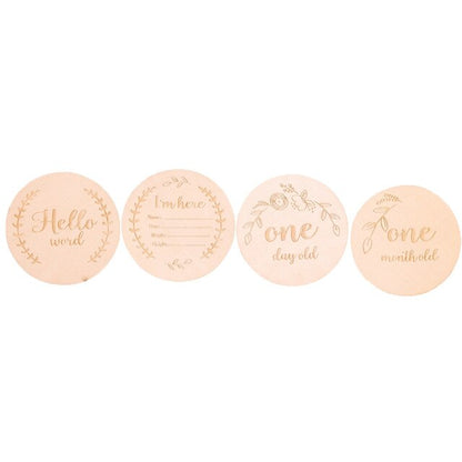 Various wooden baby milestone cards arranged, ideal baby photo props and baby shower gift set