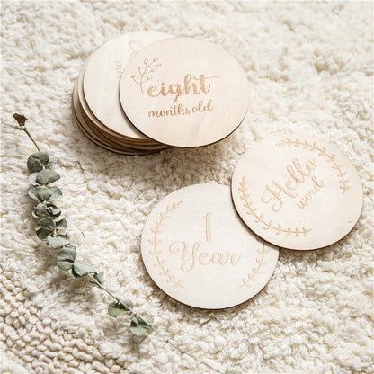 Detailed view of a natural wood baby milestone card, excellent baby accessory and keepsake gift