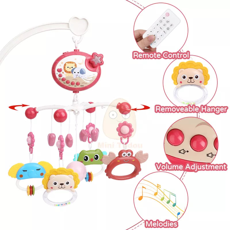 Close-up of a baby musical crib mobile, showing plush hanging toys and projector light