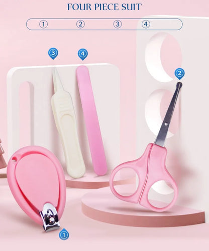 Hand holding a baby nail scissor from the kit, demonstrating its safe size for infant use